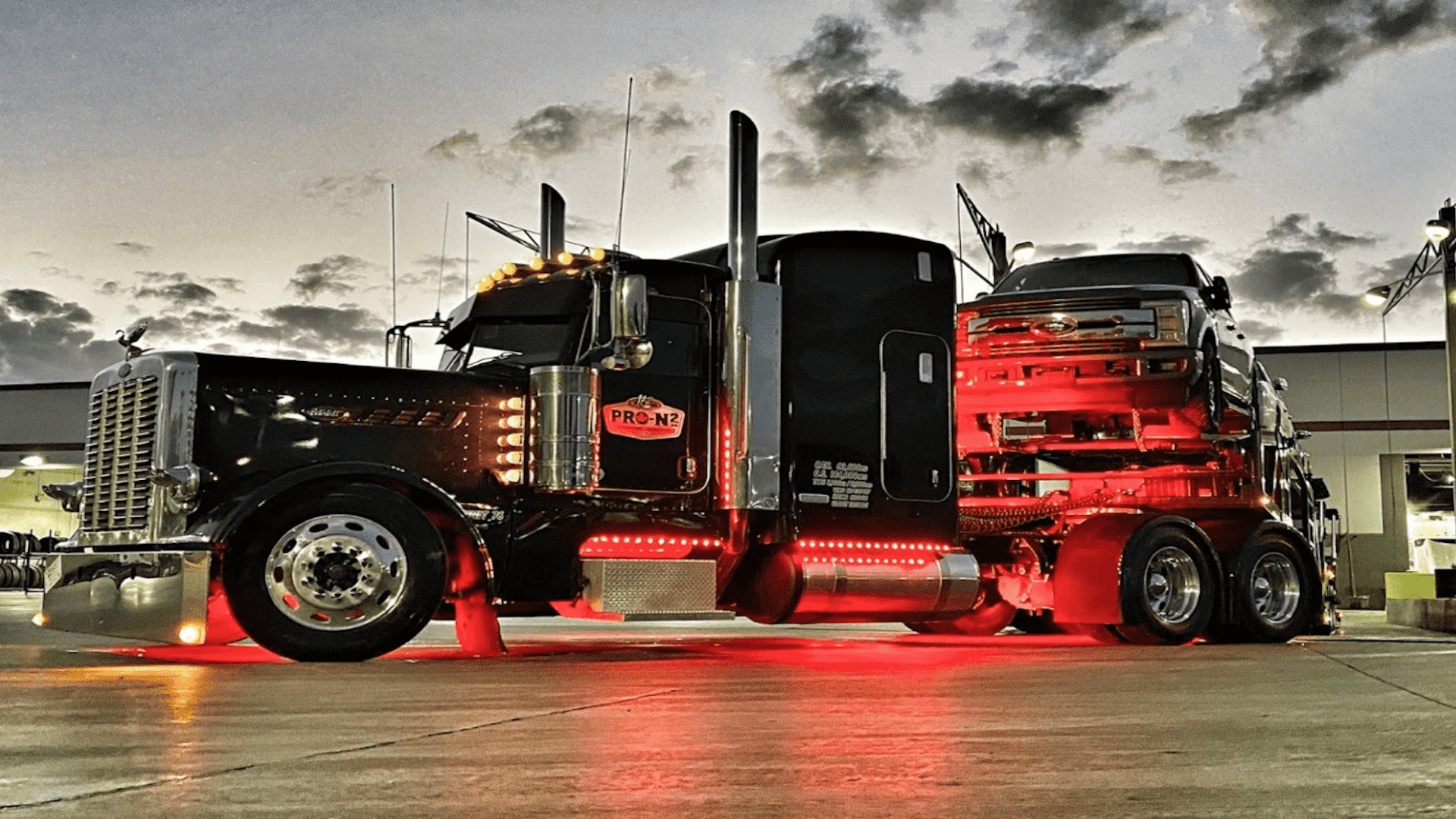 A car hauler pulling two decks of cars